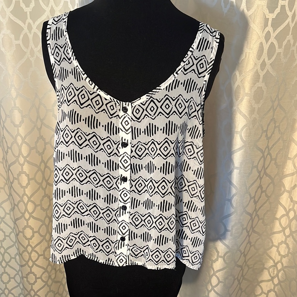 Forever 21 black and white women’s top with black button front. Size M